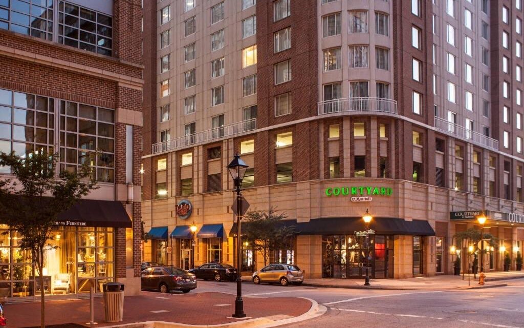 The Courtyard by Marriott in downtown Baltimore's Harbor East, lit at dusk