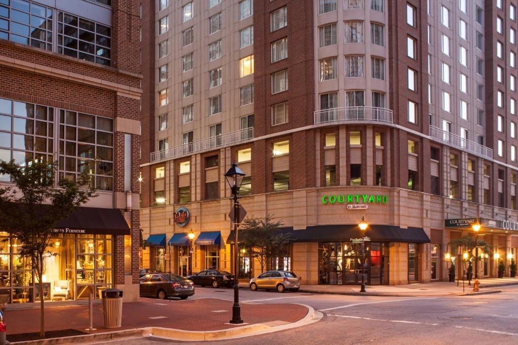 The Courtyard by Marriott in downtown Baltimore's Harbor East, lit at dusk