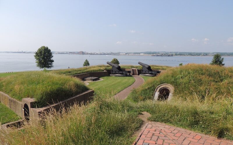 Fort McHenry's star-shaped earthworks and cannons overlooking Baltimore harbor