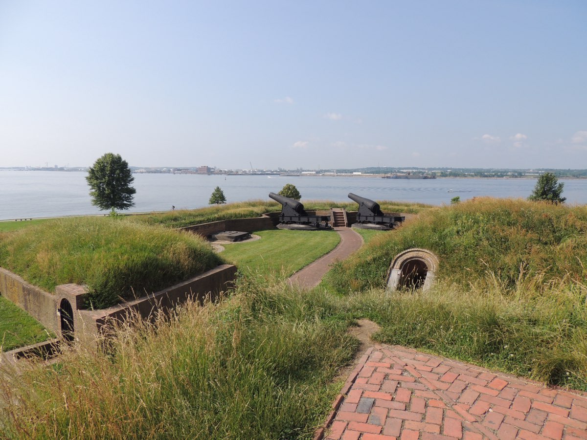 Fort McHenry's star-shaped earthworks and cannons overlooking Baltimore harbor