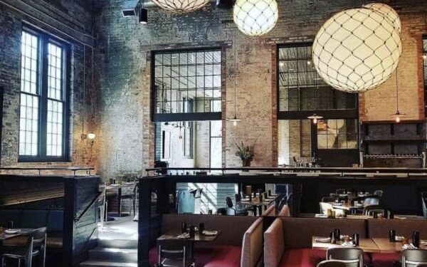 The industrial brick dining room at True Chesapeake Oyster Co. in Whitehall Mill