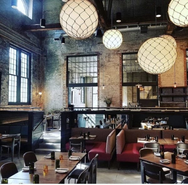 The industrial brick dining room at True Chesapeake Oyster Co. in Whitehall Mill